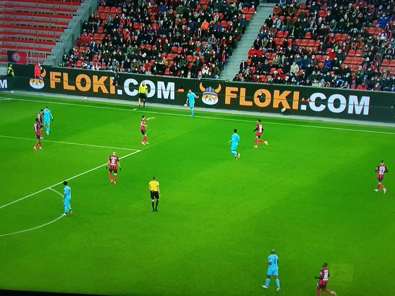 A BOMES ad in a football stadium.